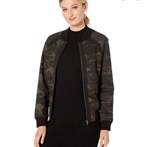 Women’s camo bomber jacket. Worn only a few times. Excellent used condition.